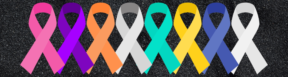 Cancer awareness ribbons for breast cancer (pink), pancreatic cancer (purple), Leukemia (orange), brain cancer (gray), ovarian cancer (teal), bone cancer (yellow), colon cancer (dark blue) and lung cancer (white) on a sparkly black background.